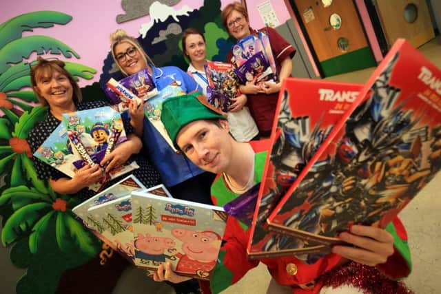 Mathew Gibson has been in and out of hospital and wanted to give something back so he is handing out presents on Ward 25 at Kings Mill Hospital. Mathew is pictured with staff members Elaine Smithurst, Lisa Hill, Jody Hill, and Julie Kinnison.