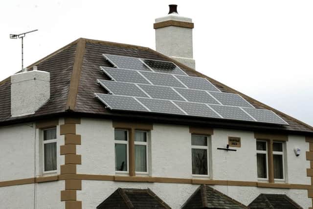 Solar panels are a popular way for households to harness greener renewable energy. Photo: PA/Rui Vieira