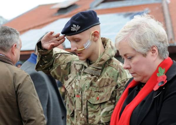 Mansfield Remembrance wreath laying. 
Cadet Jacob Fradgley from the Army Cadet Force salutes after laying his wreath alongside Coun. Sonya Ward.