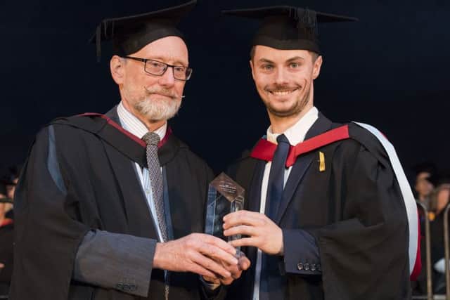 Alex England receives his Student of the Year award from Nevil Croston, chairman of the college board of governors. Photo: Tracey Whitefoot