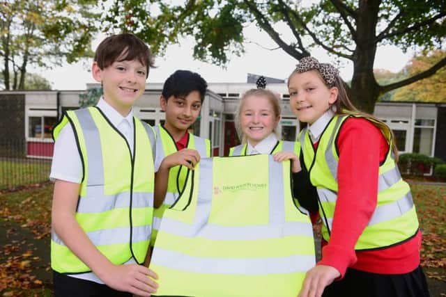 Berry Hill pupils with some of the hi-vis vests. Photo: Steve Baker