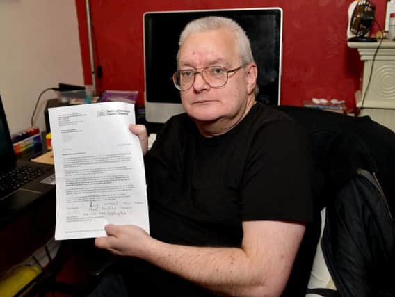 Daryl Lees, aged 53, with the letter he received from Nottinghamshire County Council