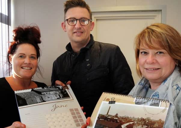 Emma Olden, Mark Newland and Dawn Justice with the Selston and Underwood calendar.