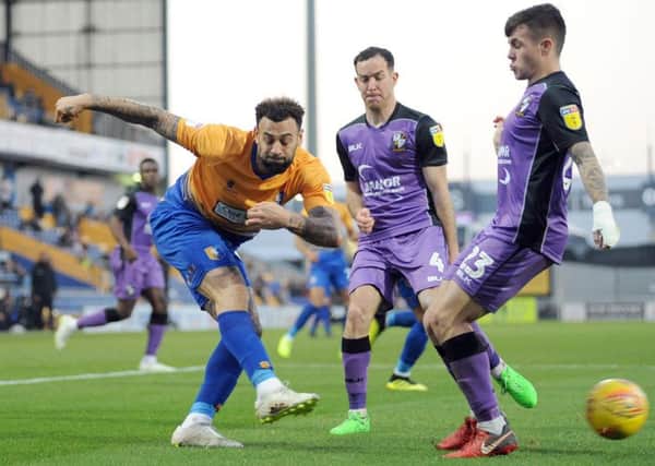 Mansfield Town v Port Vale.      
Craig Davies gets a cross in to the 'Vale penalty box.