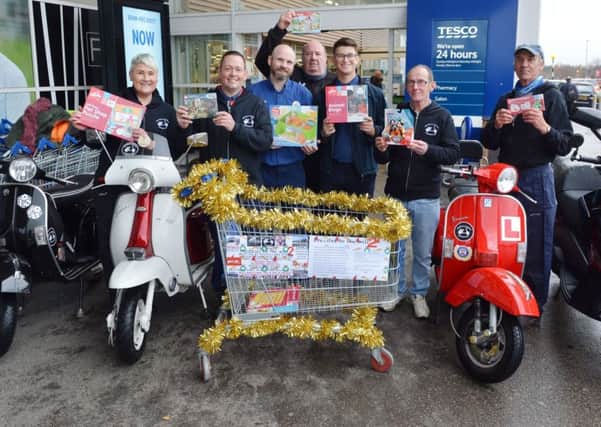 Sutton In Ashfield Scooter club getting ready for their annual ride delivering presents to Kings Mill Hospital.