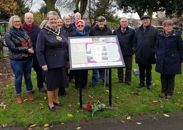 The new information panel is unveiled  at Sutton by the chairman of Nottinghamshire County Council, Coun Sue Saddington, and members of the Pentrich Revolution Group.