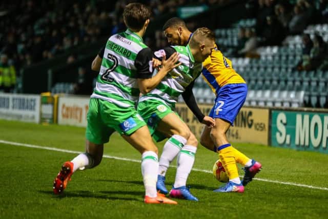 Mansfield Town's CJ Hamilton takes on the Yeovil defence. (PHOTO BY: Chris Holloway)