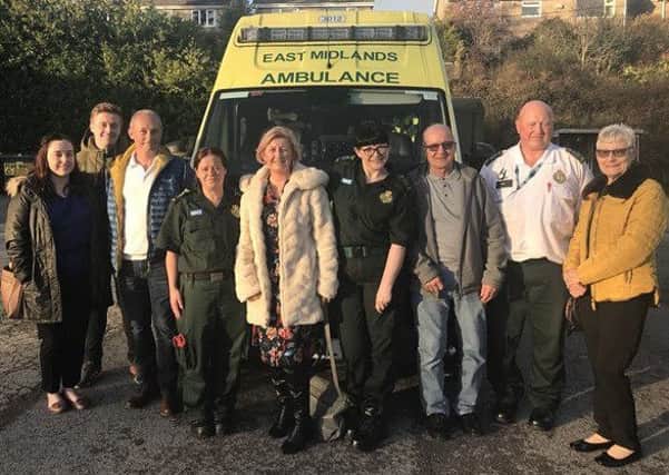 Toms family pictured with East Midlands Ambulance paramedics.