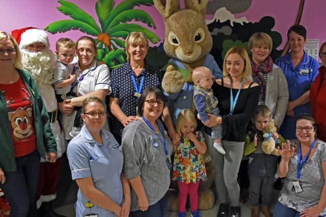 Staff, parents and patients meet Santa and Peter Rabbit