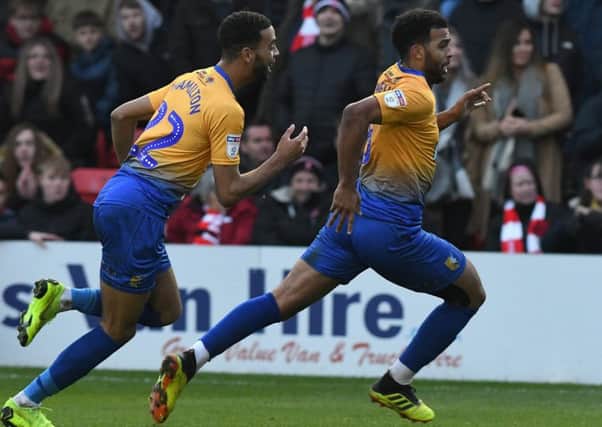 Mansfield's Jacob Mellis celebrates his equalising goal against Lincoln.