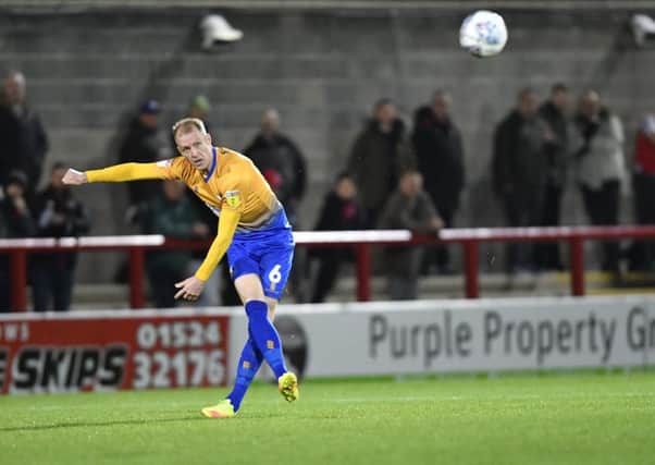 Mansfield Town's Neal Bishop crosses the ball : Picture by Steve Flynn/AHPIX.com, Football: Skybet League 2  match Morecambe -V- Mansfield Town at Globe Arena, Morecambe, Lancashire, England on copyright picture Howard Roe 07973 739229