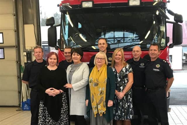 Louise Brownley, with nurses from King's Mill's breast cancer unit, along with fire crews from Mansfield Fire Station