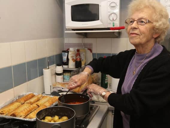 Volunteer Mary Doubtfire cooking lunches