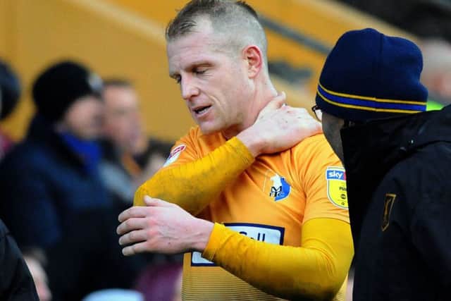 Mansfield Town v Notts County
Neal Bishop goes off injured during the Stags' clash with Notts County on Saturday.