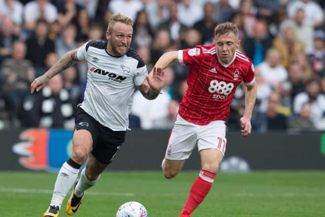 Derby's Johnny Russell and Forest's Ben Osborn battle it out in 2017.