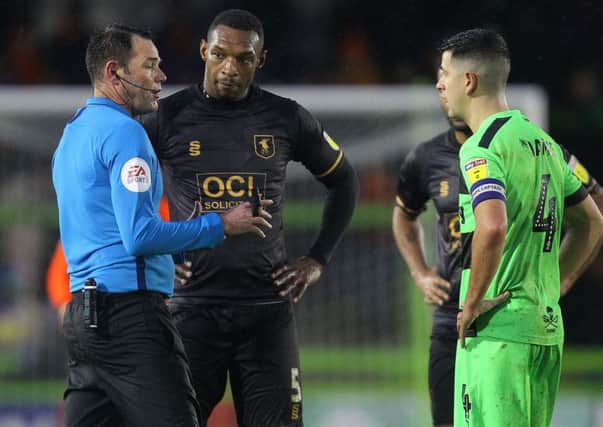 Picture by Gareth Williams/AHPIX.com; Football; Sky Bet League Two; Forest Green Rovers v Mansfield Town; 15/12/18  KO 15:00; The New Lawn; copyright picture; Howard Roe/AHPIX.com; Referee James Linington speaks to both captains as conditions worsened at The New Lawn