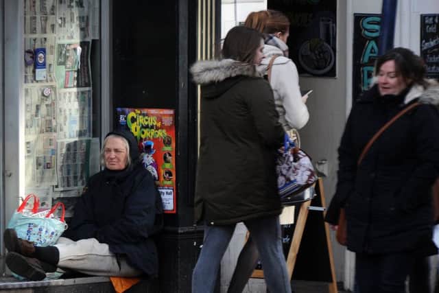 A homeless person in a shop front. Picture: Andrew Roe