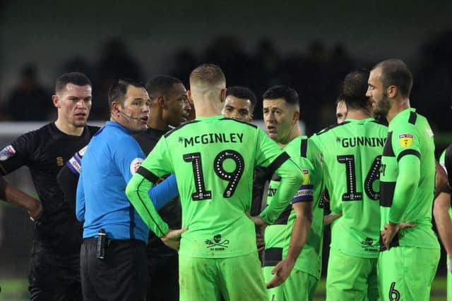Picture by Gareth Williams/AHPIX.com; Football; Sky Bet League Two; Forest Green Rovers v Mansfield Town; 15/12/18  KO 15:00; The New Lawn; copyright picture; Howard Roe/AHPIX.com; Referee James Lingington asks Mansfield and Forest Green Rovers players if they wish to continue before abandoning the game at half time