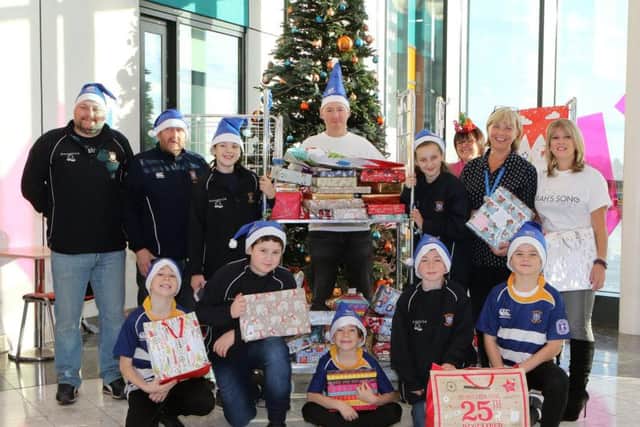 Team Corah and their supprters from Mansfield Rugby club, distributing presents to the Children's ward at Kings Mill Hospital