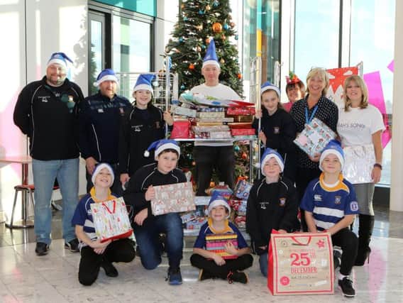 Team Corah and their supprters from Mansfield Rugby club, distributing presents to the Children's ward at Kings Mill Hospital