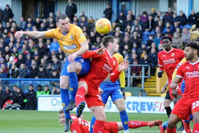 Ryan Sweeney heads on goal against Swindon.