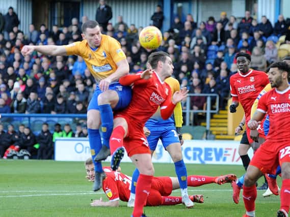 Ryan Sweeney heads on goal against Swindon.