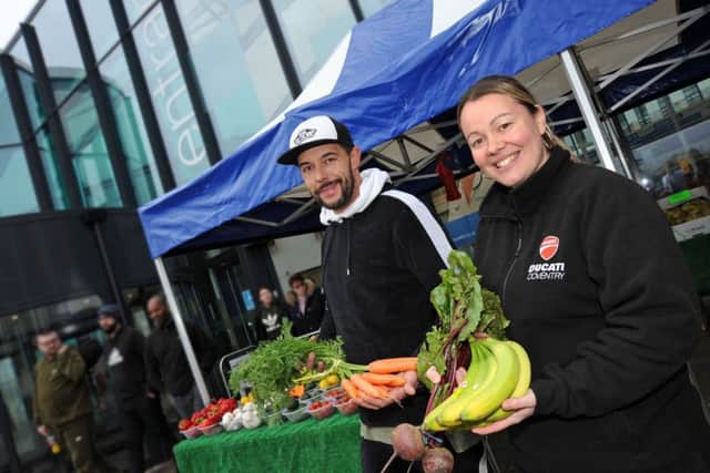 Roxanne Burrows and Laiten McGuigan on their Roots Fruits and Shoots veg stall outside the main entrance at Kings Mill Hospital.