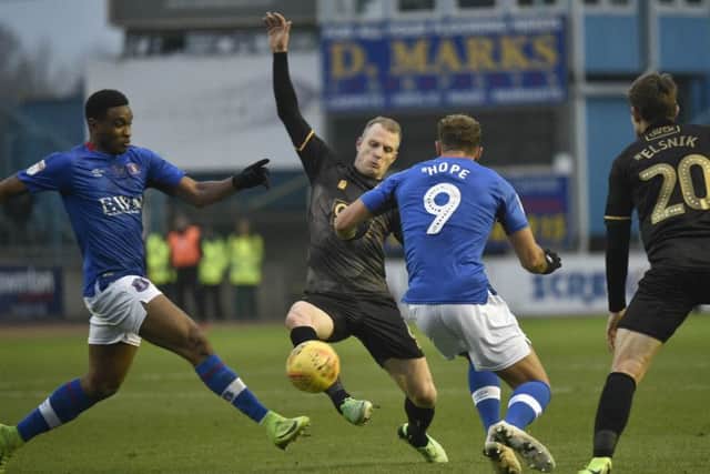 Mansfield Town's Neal Bishop competes for the ball with Carlisle United's Kelvin Etuhu: Picture by Steve Flynn/AHPIX.com