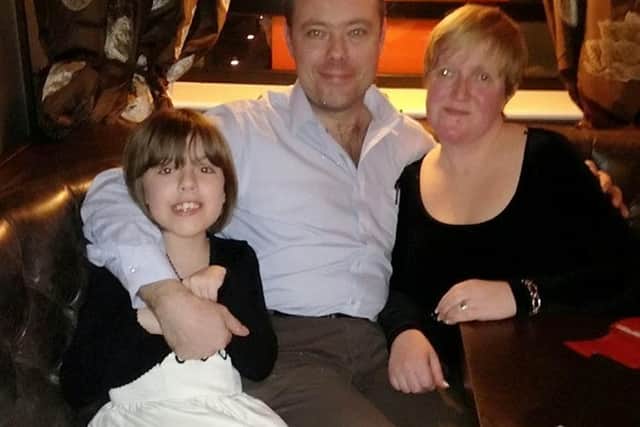 Emma with husband Peter and daughter Paige