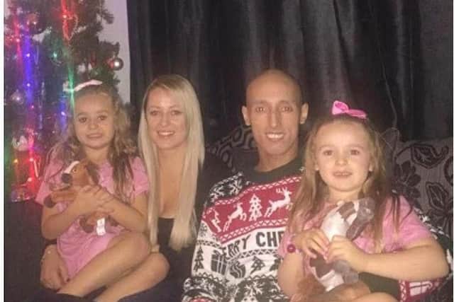 Travis with wife Harriet and daughters Freya and Bella.