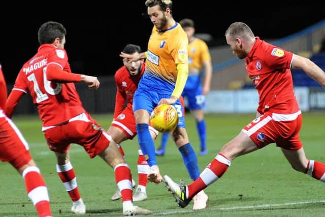 Jorge Grant chips a ball over the Crawley defence for a CJ Hamilton chance.