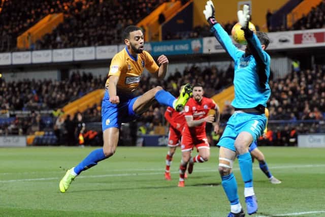 CJ Hamilton chips the keeper to see his attempt land on top of the Crawley net.