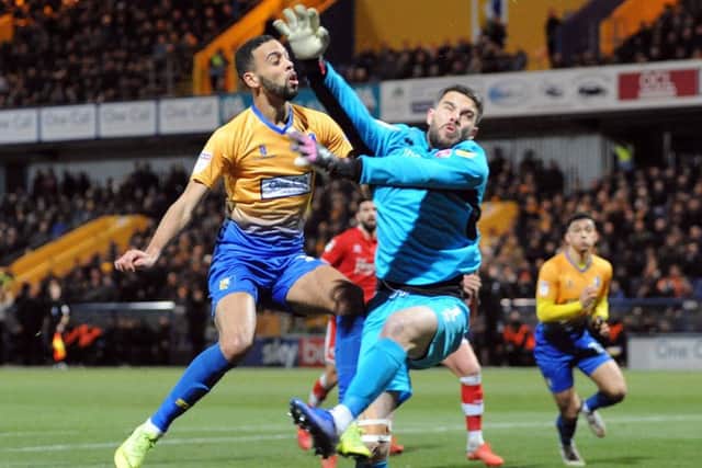 CJ Hamilton chips the keeper to see his attempt land on top of the Crawley net.