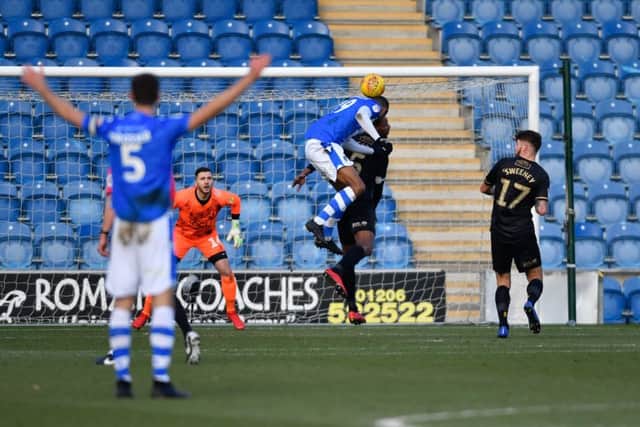 Colchester United's MikaÃ«l Mandron heads down for Tom Eastman to score.