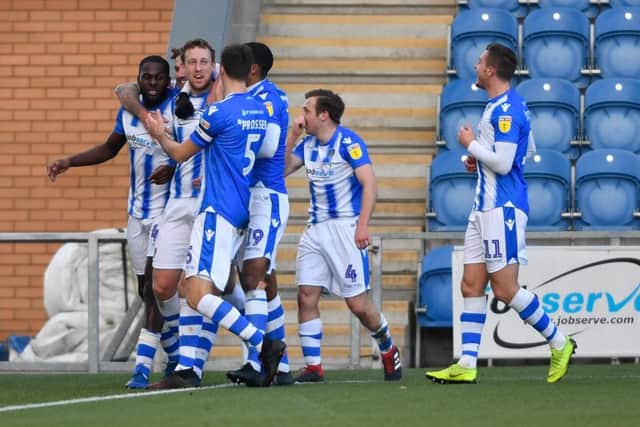 Colchester United's Tom Eastman celebrates his opening goal of the game.