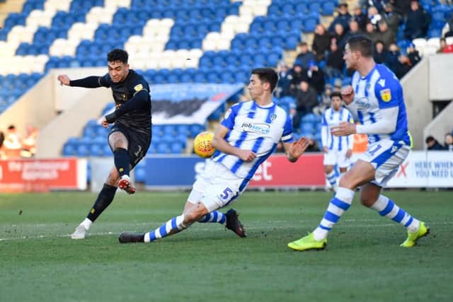 Mansfield Town's Jacob Mellis drives a shot at the Colchester United goal.