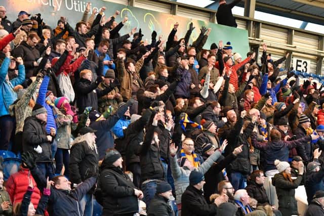 Stags fans celebrate their second goal to make it 2-2 as the comeback gathers momentum.