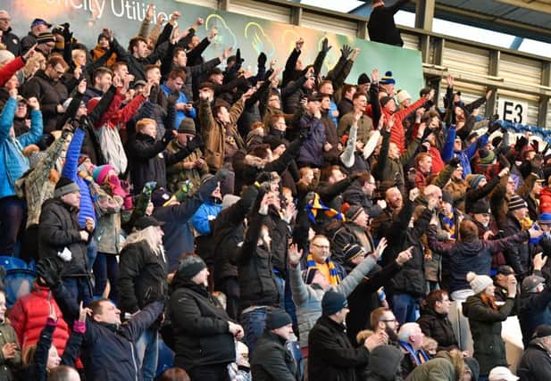 Stags fans celebrate their second goal to make it 2-2 as the comeback gathers momentum.