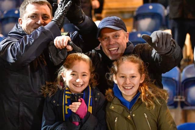 Thumbs up for promotion from these Stags fans at Colchester.