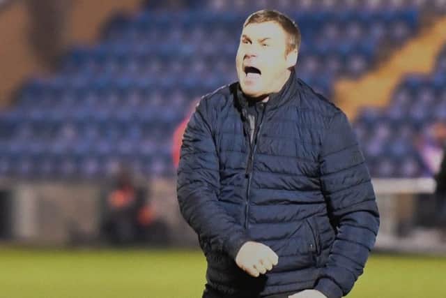Mansfield Town manager David Flitcroft celebrates his side's great comeback win after the game.