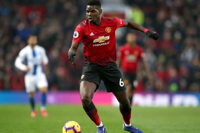 MANCHESTER, ENGLAND - JANUARY 19:  Paul Pogba of Manchester United runs with the ball during the Premier League match between Manchester United and Brighton & Hove Albion at Old Trafford on January 19, 2019 in Manchester, United Kingdom.  (Photo by Jan Kruger/Getty Images)