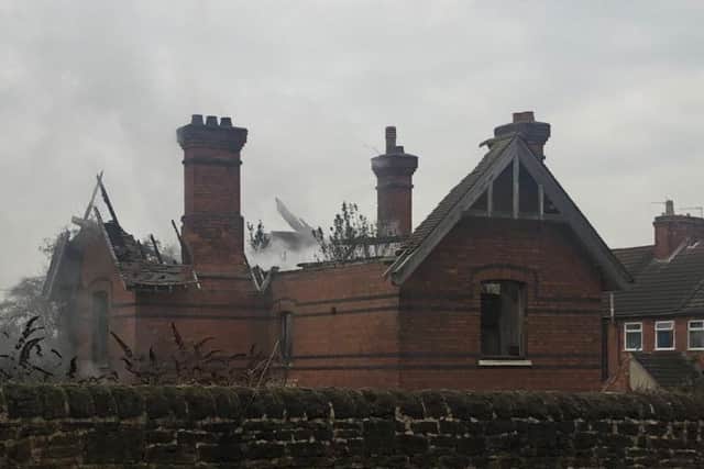 The rive-ravaged derelict building.
