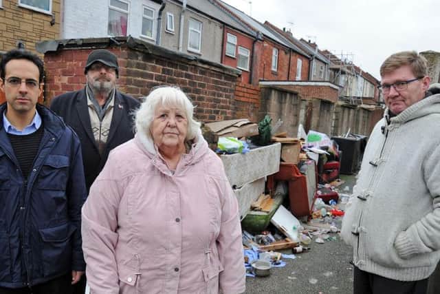 Janice and Michael Melbourne who are supported by fellow Victoria Street resident, Glenn Booth, right, and George Jabbour, left, the Conservative Mayoral candidate, in their fight against charges from Mansfield District Council for fly-tipping removal.