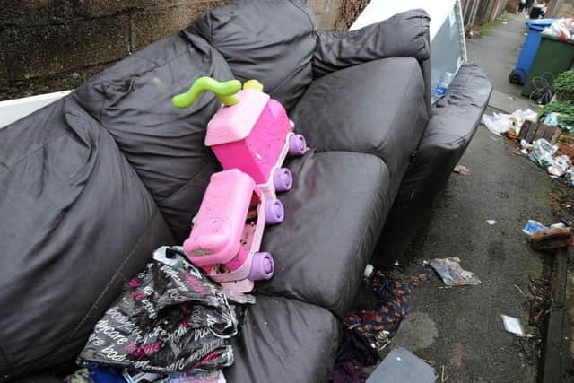 The rubbish strewn alleyway between Victoria Street and Moor Street homes.