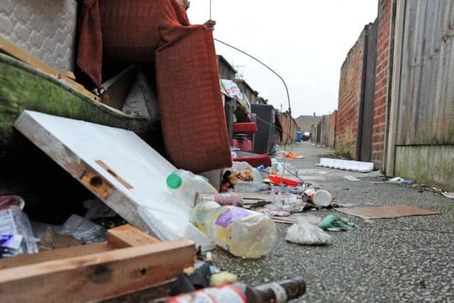 The rubbish strewn ally-way between Victoria Street and Moor Street homes.