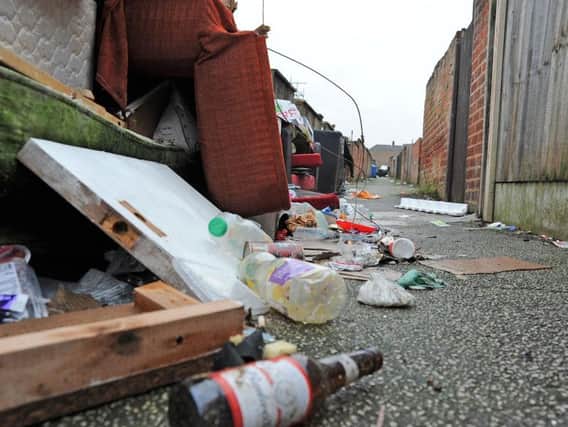 The rubbish strewn ally-way between Victoria Street and Moor Street homes.