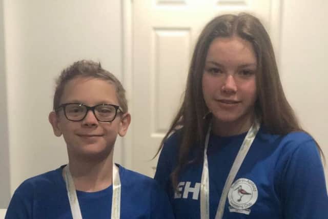 Siblings Ellethea and Evan Hawley with the gold medals they won at the county championships.