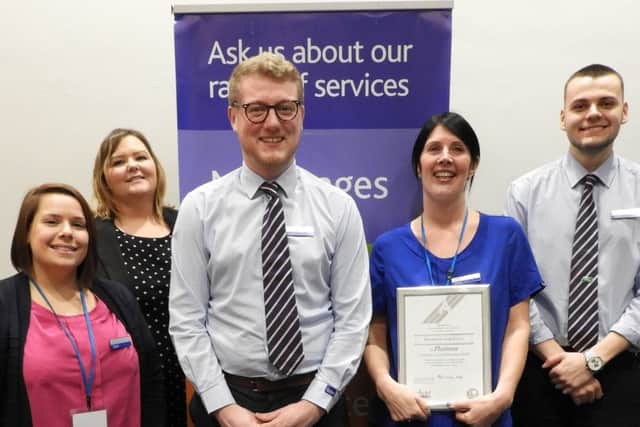 Nicola Caulton, the Mansfields branch and community engagement manager, with branch sales advisers.