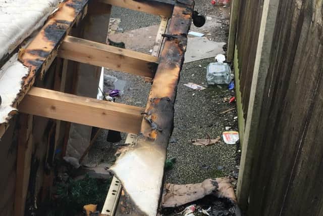 The scene of a rubbish fire in an alleyway.