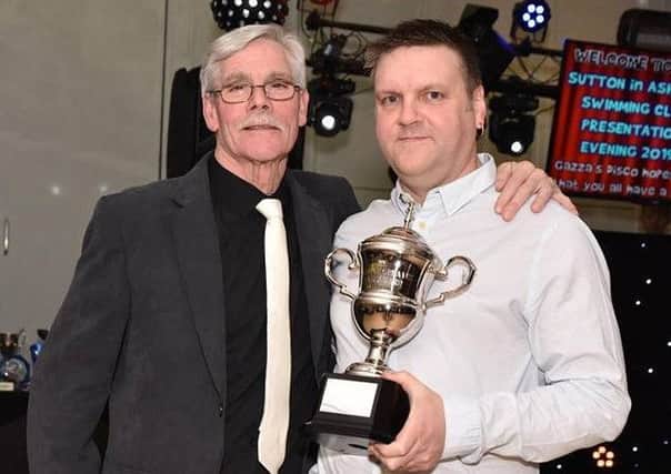 Gren Greaves presenting the new trophy to the club's head coach, Lee Bunker. (PHOTO BY: Brian Hall)